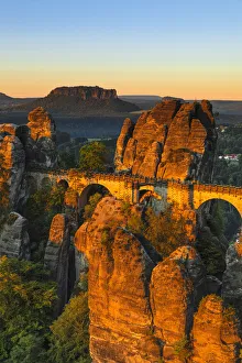 Typically German Gallery: Bastei Bridge at sunrise, Lilienstein Mountain, Elbsandstein Mountains, Saxony, Germany