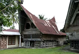 Lake Toba Prints: Batak Toba tribal rural village houses with contemporary extensions on Samosir Island in Lake Toba