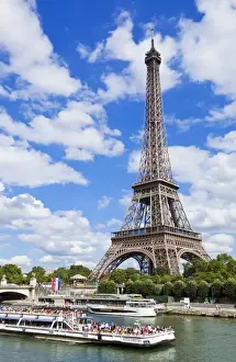 Passenger Prints: Bateaux Mouches tour boat on River Seine passing the Eiffel Tower, Paris, France, Europe