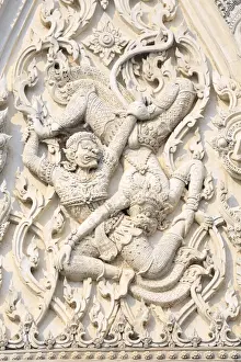 Religious Icon Prints: Detail of battling demons on Khmer style Wat Mahathat Worawihan temple in Phetchaburi