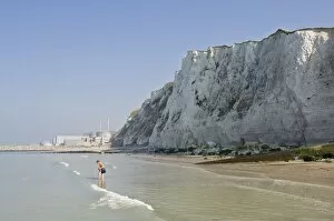 Images Dated 28th September 2008: A beach under the chalk cliffs, mother and child paddling, Nuclear Power Station in the background