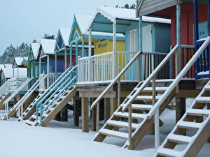 Colourful Prints: Beach huts in the snow at Wells next the Sea, Norfolk, England