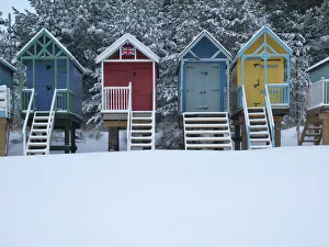 Colourful Prints: Beach huts in the snow at Wells next the Sea, Norfolk, England