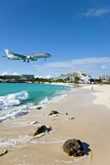Landing Prints: Beach at Maho Bay and low flying aircraft approaching the runway of Princess Juliana International airport