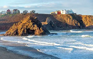 Seashore Prints: Beach with rocky outcrop on coastline in bay
