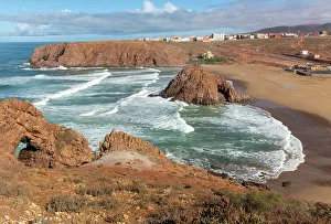 Ocean Waves Prints: Beach with rocky outrcop and coastline in bay