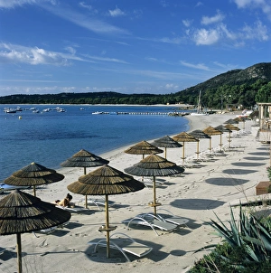 Umbrellas Prints: Beach view, Pinarellu, southeast coast, Corsica, France, Mediterranean, Europe