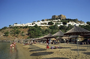 The beach below the white houses and acropolis of Lindos Town