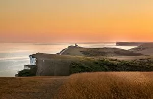 Direction Gallery: Beachy Head and the Belle Tout lighthouse at dusk, near Eastbourne, East Sussex, England