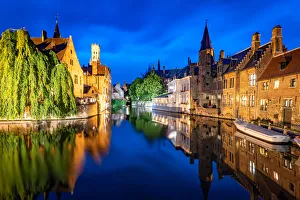 The beautiful buildings of Bruges reflected in the still waters of the canal, UNESCO
