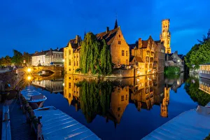 The beautiful buildings of Bruges reflected in the still waters of the canal, UNESCO