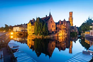 The beautiful buildings of Bruges reflected in the still waters of the canal, UNESCO