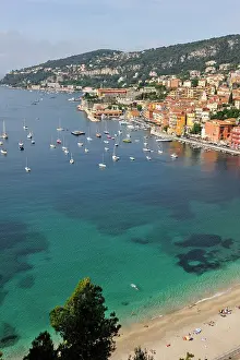 Footpath Prints: Beautiful coastal view of Villefranche-sur-Mer with boats in clear water and colorful buildings along the shore