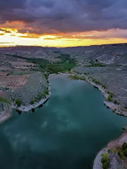 Cappadocia Prints: Beautiful sunset over Akkoy dam lake in Cappadocia with reflections on the water