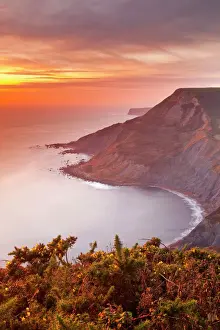 Glowing Prints: A beautiful sunset over Chapmans Pool on Dorsets Jurassic Coast