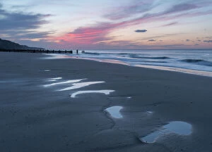 Dramatic Sky Gallery: Beautiful sunset colours over the beach at low tide at Mundesley, Norfolk, England