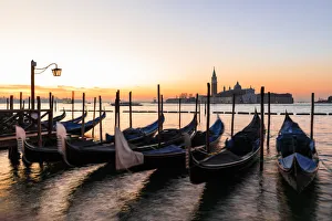 Gondola Prints: Beautiful Venetian sunrise in winter, gondolas, San Giorgio Maggiore and Lido, Venice
