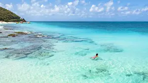 Mid Adults Prints: Beautiful woman enjoying swimming in the crystal Caribbean Sea