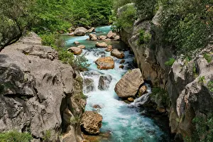 Antalya Prints: Beautiful Yazili canyon waterfall flows between gray rocks in Antalya