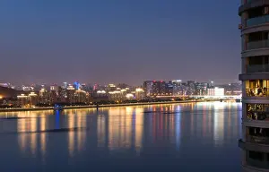 Hangzhou Prints: Beautifully illuminated high rises on Qiantang River in Hangzhou, Zhejiang province