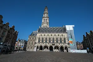 Clock Prints: Belfries of Arras stands tall in the square under bright blue sky in France