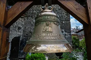 Bells Prints: Bell hangs in church at Abaata fortress in Gagra Abkhazia during bright daylight hours to signal worship activities