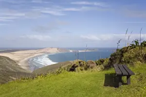 Northland Prints: Bench by Cape Reinga Coastal Walkway on cliff top with view to Te Werahi Strand beach