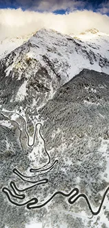 Engadine Prints: Bends of Maloja Pass road on snowy mountain ridge, aerial view, Bregaglia Valley