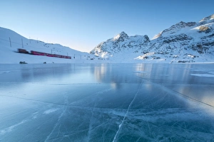 Motion Blur Prints: The Bernina Express train runs beside the frozen Lago Bianco