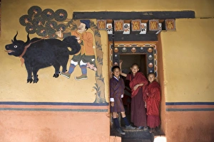 Clothes Prints: Bhutanese boy and monks, Paro Dzong, Paro, Bhutan, Asia