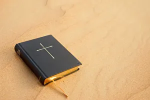 Images Dated 3rd May 2008: Bible on sand, Dubai, United Arab Emirates, Middle East