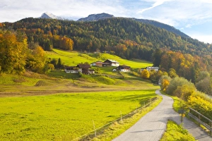 Bicycle path through rural mountain landscape in autumn, near Berchtesgaden, Bavaria, Germany, Europe