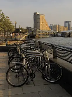 Docklands Prints: Bicycle racks, Canary riverside walk alongside River Thames, Canary Wharf