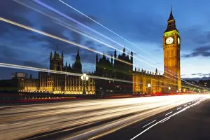 Big Ben and The Houses of Parliament at night with traffic trails on Westminster Bridge