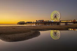 Lancashire Collection: Big wheel and amusements on Central Pier at sunset, Blackpool, Lancashire, England