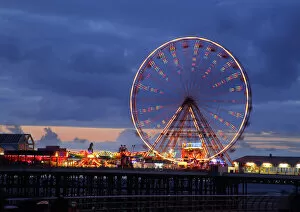 Lancashire Collection: Big wheel and funfair on Central Pier lit at dusk, Blackpool Illuminations, Blackpool