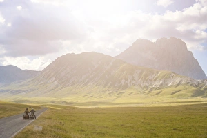 Plateau Prints: Bikers in plateau Campo Imperatore at sunset, Gran Sasso e Monti della Laga National Park
