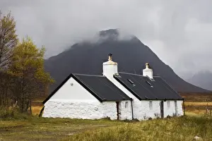 Single Storey Prints: Black Rock Cottage and Buachaille Etive Moor with rain approaching, Rannoch Moor