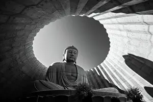 Hokkaido Prints: Black and White of a Buddha statue framed in circular architecture