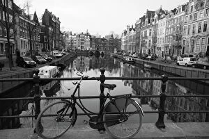 Railing Gallery: Black and white imge of an old bicycle by the Singel canal, Amsterdam, Netherlands