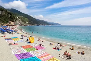 Blanket Prints: Blanket sellers showcasing their products on the beach at Monterosso, Cinque Terre