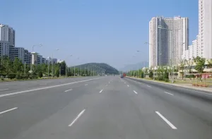 Pyongyang Prints: Blocks of flats beside road to Nampo