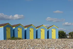 Uniformity Prints: Five blue beach huts with yellow doors