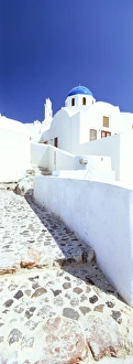 Blue domed church and whitewashed buildings