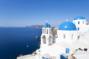 Blue domed churches in the village of Oia, Santorini (Thira), Cyclades Islands