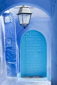 Moroccan Prints: Blue door and wall in the old town of Chefchaouen (Chaouen) (The Blue City), Morocco