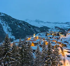 Valle Spluga Prints: Blue dusk over snowcapped mountains and woods around the alpine huts of Pianazzo