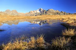 Mountain Peak Prints: Blue lake frames the peaks of Mount Disgrazia and Cornibruciati