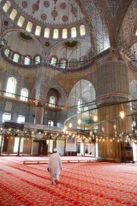 Carpet Prints: Blue Mosque interior, UNESCO World Heritage Site, mullah in foreground, Istanbul