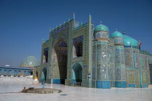 Worship Prints: Blue mosque stands tall in Mazar-e-Sharif with intricate tile work and clear sky above